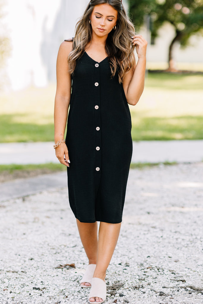 black dress with buttons down the front