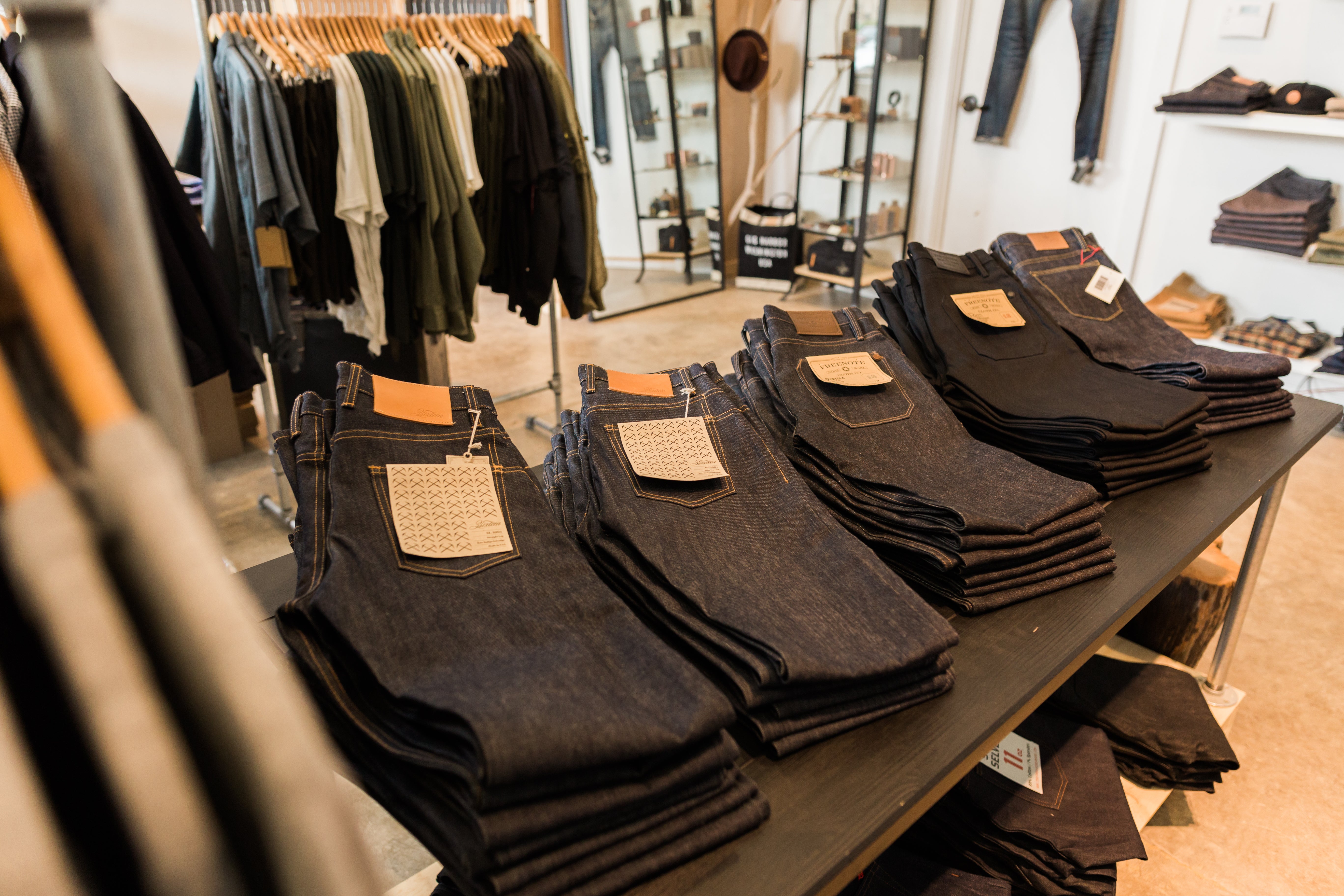 Selection of jeans on a display table.