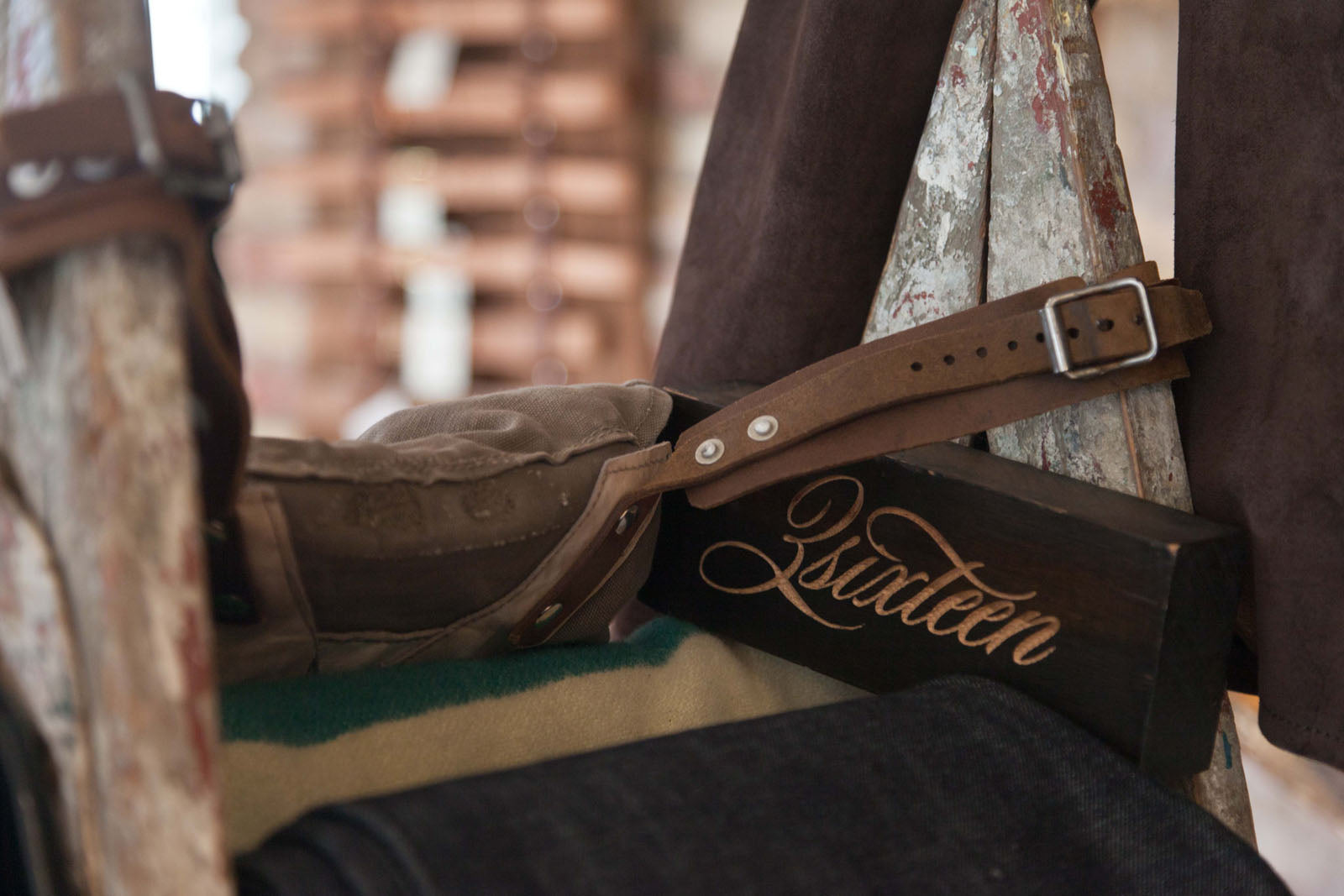 Closeup shot of a 3sixteen woodprint on a table.