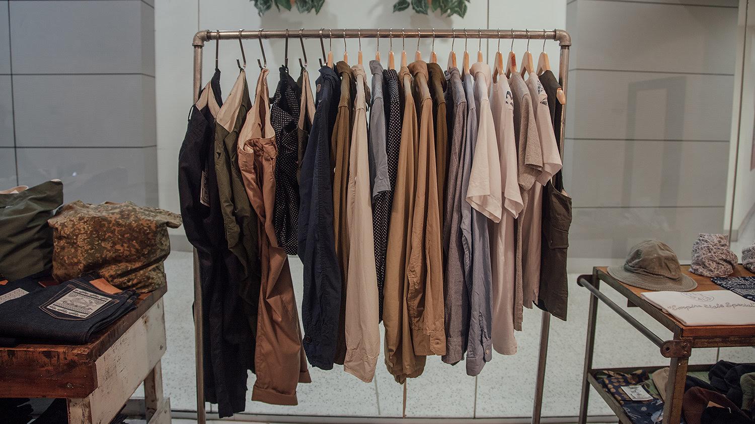 Clothes hanging on racks.