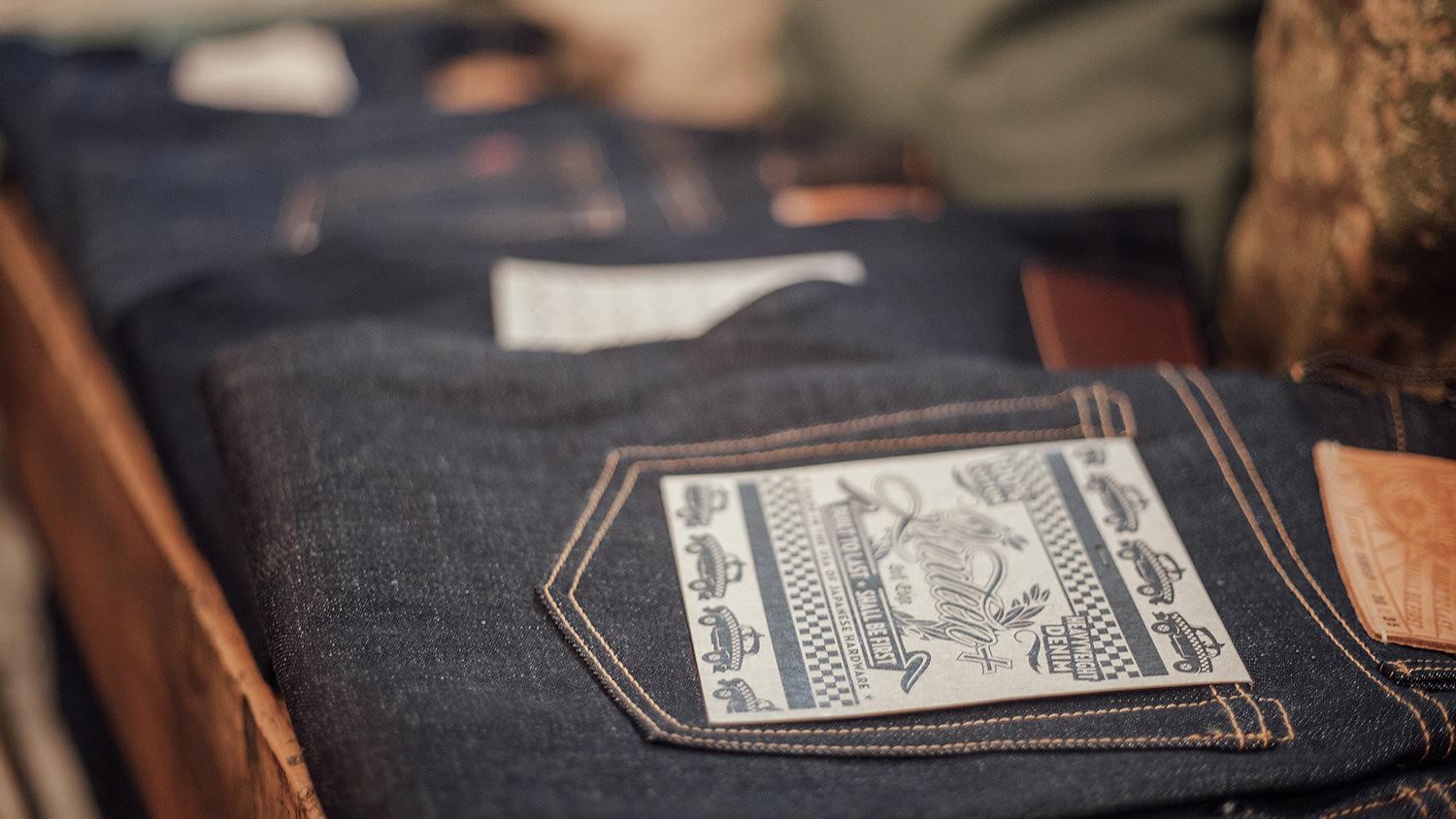 Close view of jeans on table.