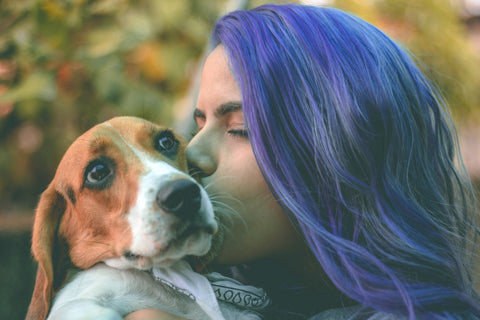 Woman with Purple Hair Kissing Dog
