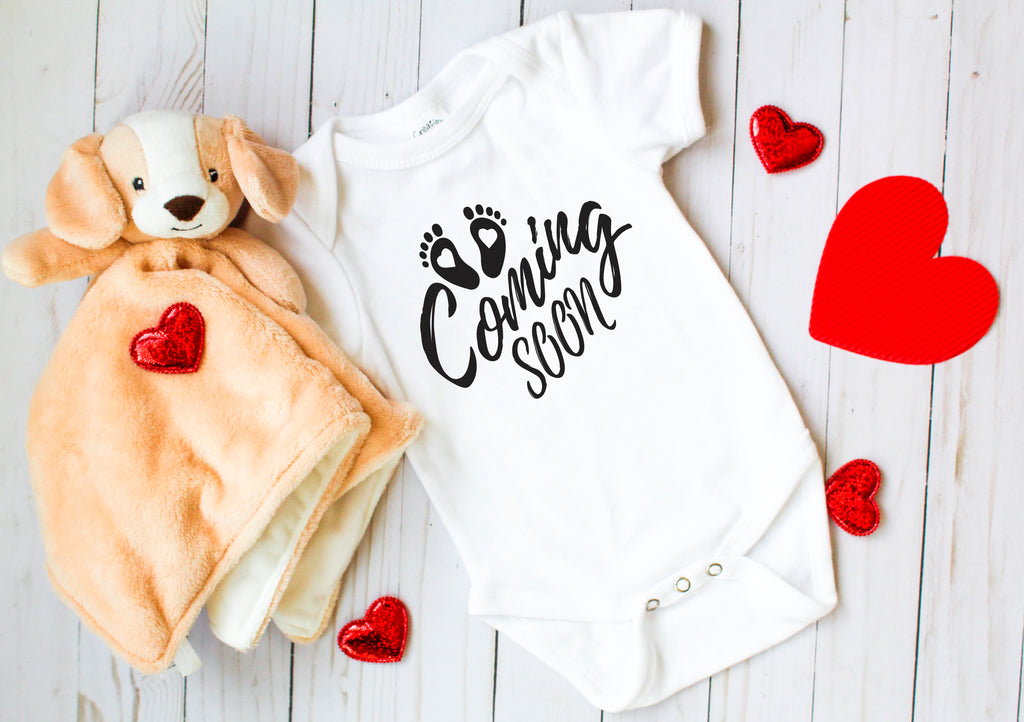 ndapprenticeships® Baby Coming Soon Heart Foot Prints Pregnancy Reveal Announcement Baby Romper Bodysuit