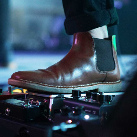 chelsea boots at rock concert close up