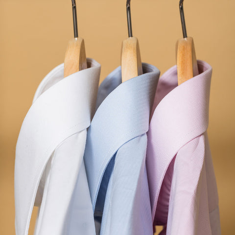 slim fit dress shirts in three colors hung up profile view