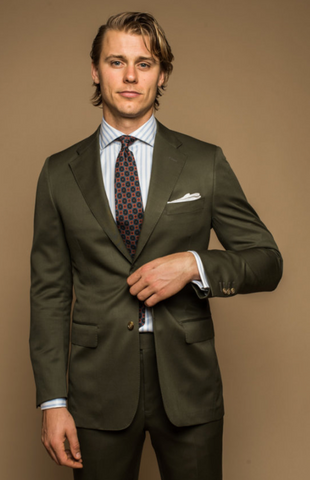 man in olive suit