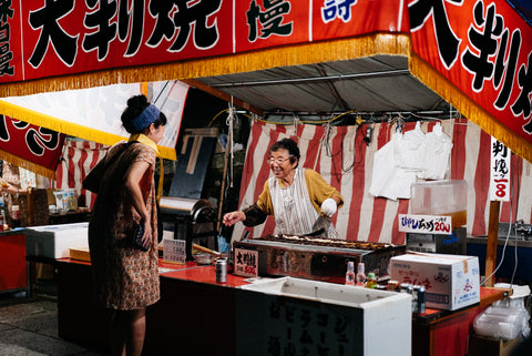 Food stall vendor selling Japanese food at a matsuri