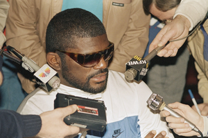 80s NFL player Lawrence Taylor wearing sunglasses