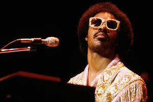 Stevie Wonder performing wearing sunglasses