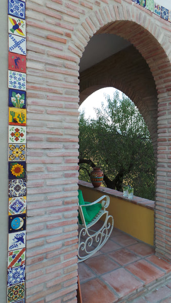 An arch with a tiled detail