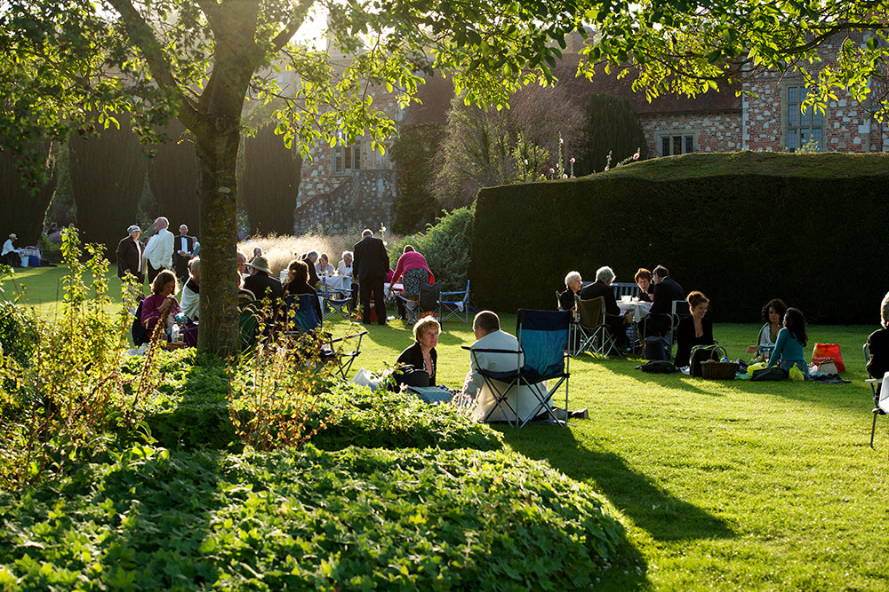 People picnicking in the garden at Glyndebourne opera