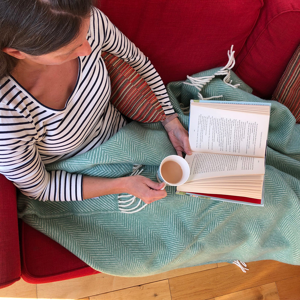 Snuggled up on the sofa in a wool blanket