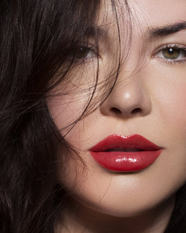 Close up shot of girl with glossy red lips