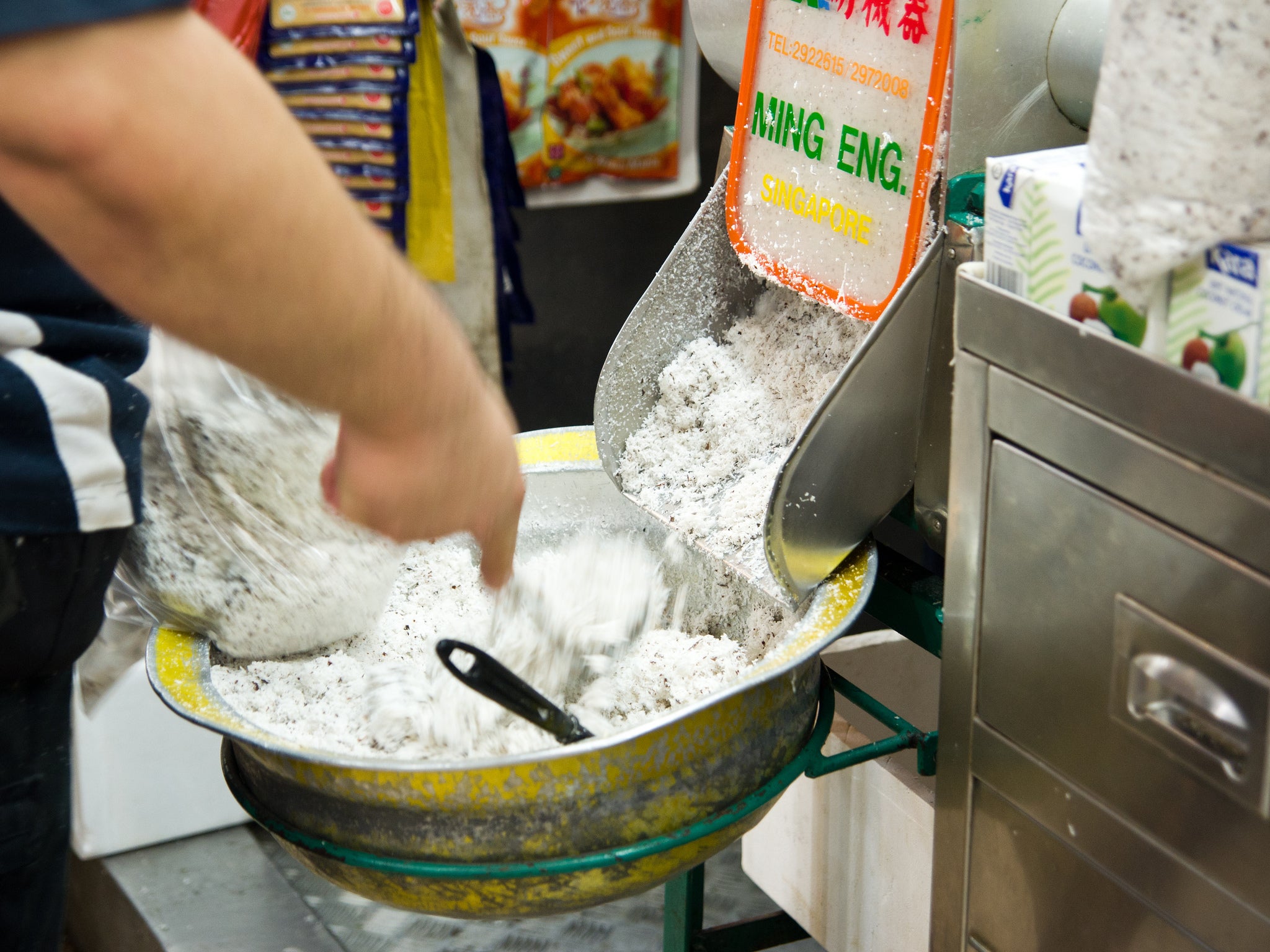 Fresh shredded coconut meat at a Singaporean market, ideal for homemade coconut milk. | Photo: Max Falkowitz~WHOLE