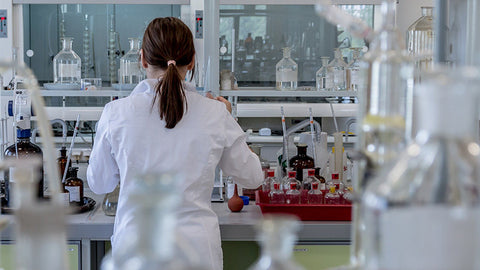 female lab tech working on hemp oil. buy hemp products online.