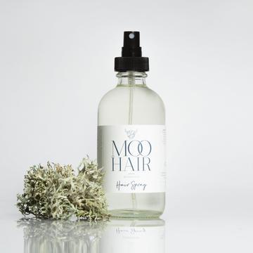 natural hair spray in glass spray bottle.