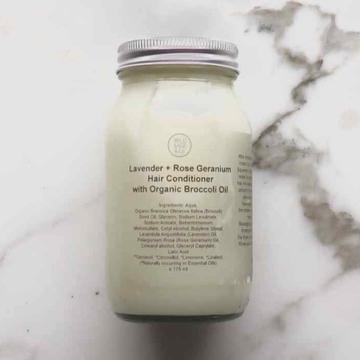 white thick plastic free conditioner in glass jar with metal lid.