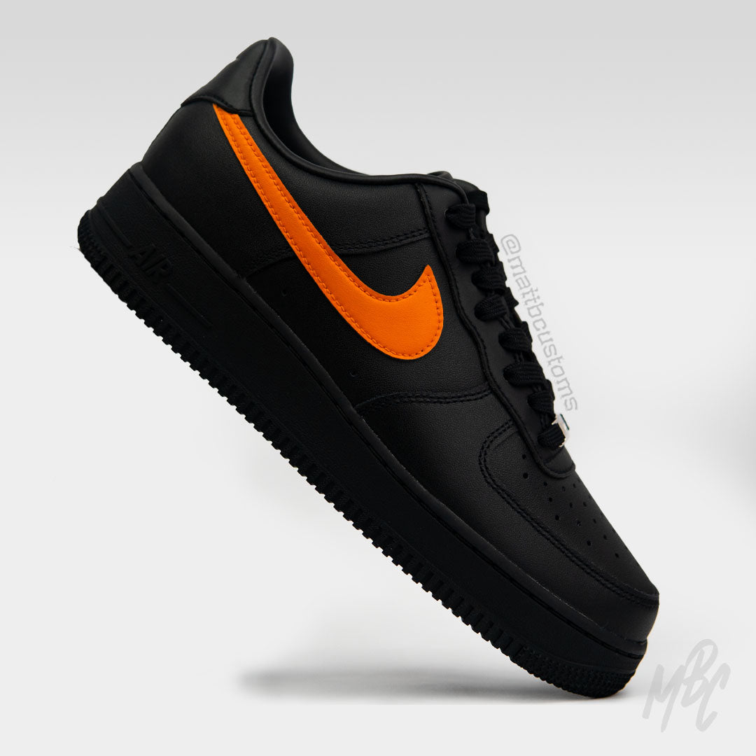 nike air forces with orange swoosh