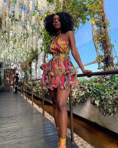 CATCH LA Instagram Black Girl with Afro and Pretty colorful dress