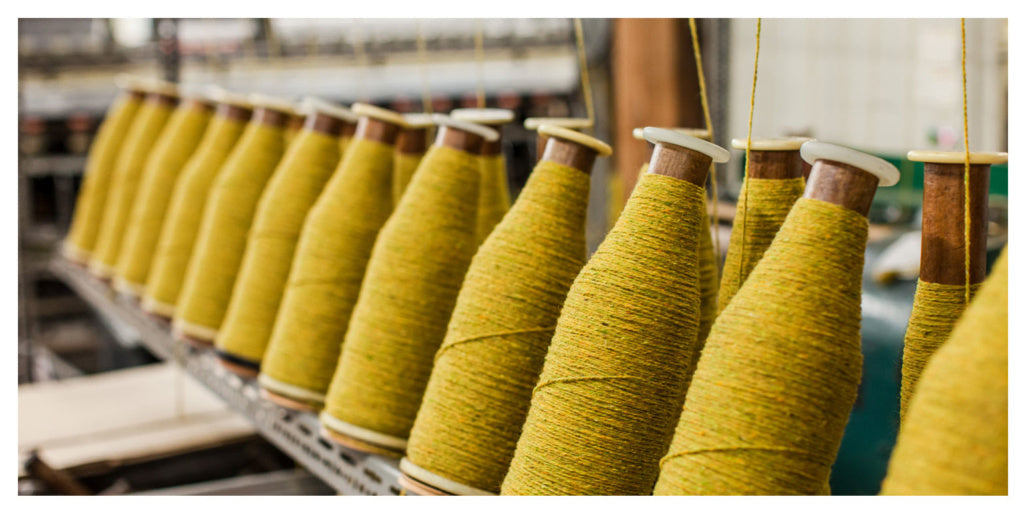 Twisted wool strands on cones