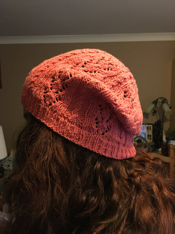 Pink lacy hat viewed from the side