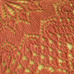 Closeup of lace shawl made from Schjeepes Whirl in Tangerine