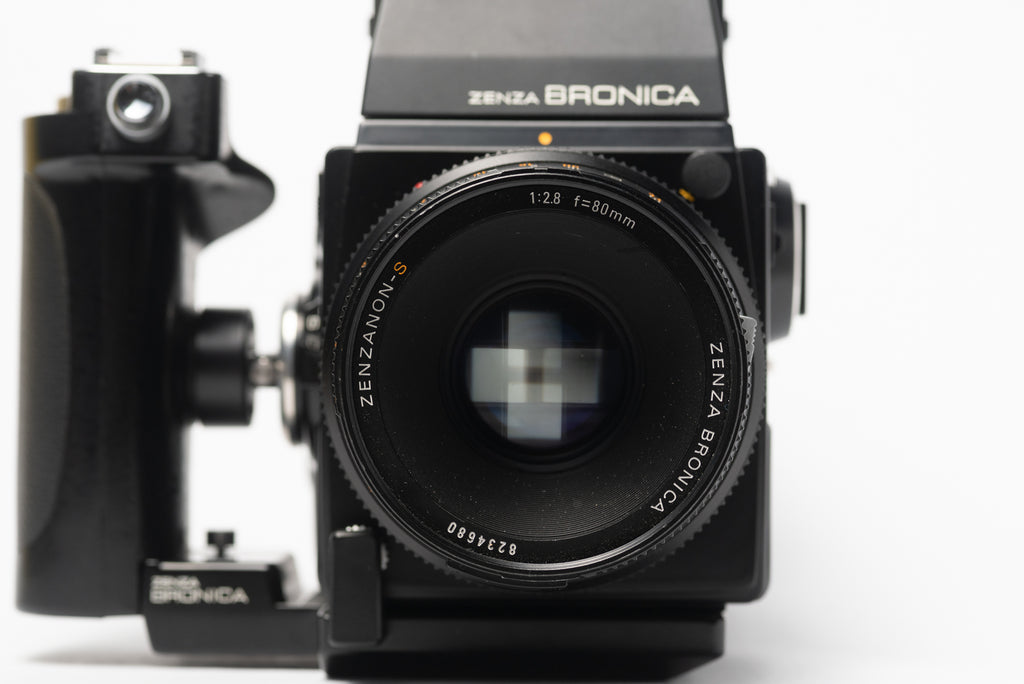 Front of Bronica SQ-A Medium Format Film Camera with 80mm 2.8 Lens, Speed Grip, and Metered Prism Viewfinder