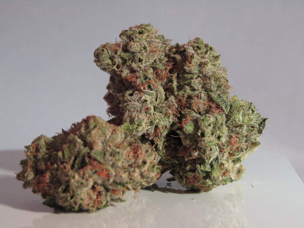 Strawberry Cheesecake nug, whole flower, fiery orange, frosty trichomes