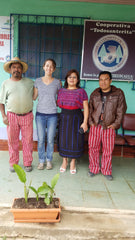 People in front of the office of a coffee co-op in Guatemala.