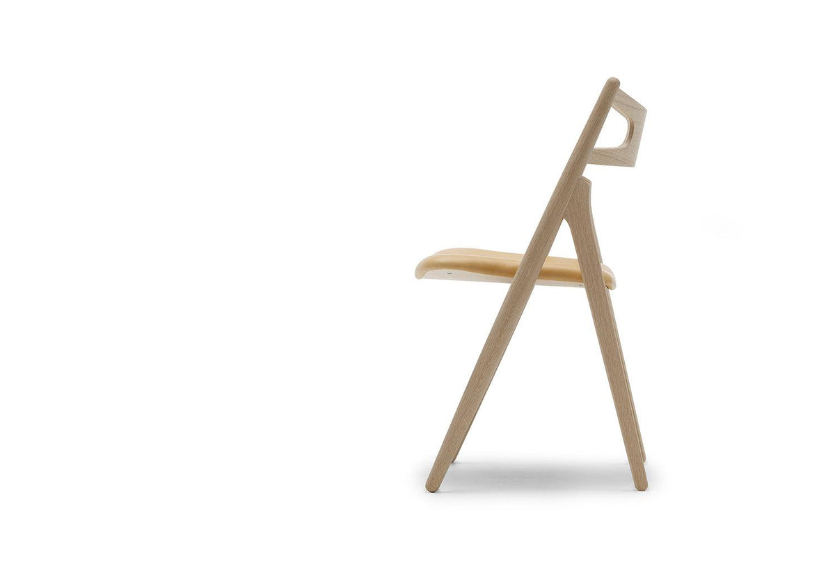 The classic CH29 dining chair, designed in 1952 by Hans Wegner, also called...