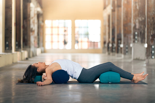 How to Use a Bolster to Open up & Unwind After a Long Day