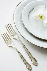 formal place setting with silver and china
