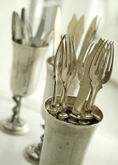 silver place settings in a cup