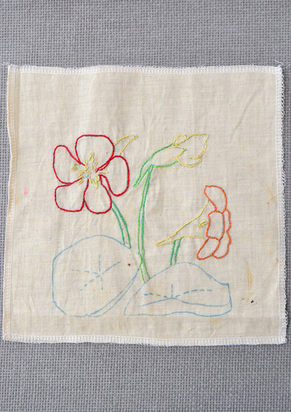 Nasturtium flower embroidery started by the grandmother of Amy Reader - a fiber artist in Charlotte, NC.