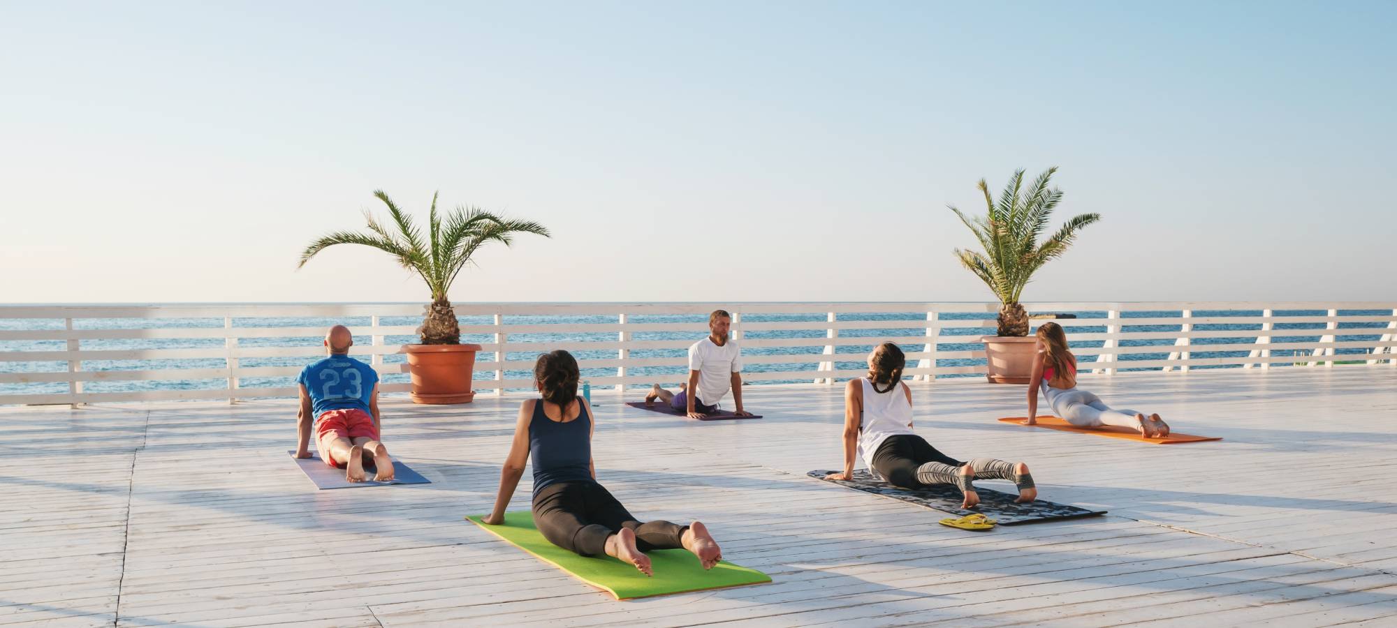 group yoga retreat overlooking water