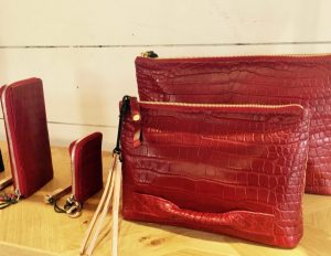A selection of red leather accessories