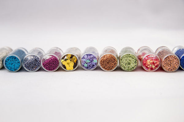 row of jars filled with beads