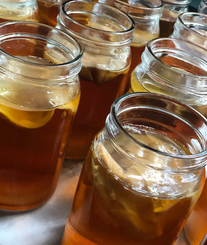 SCOBY in tea. I sometimes add two SCOBY's to make the batch stronger.