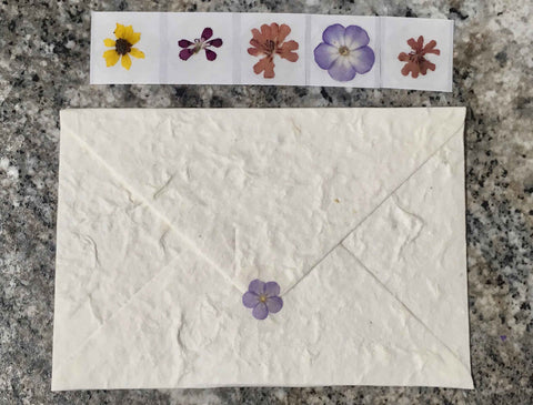 pressed flower sticker on a envelope