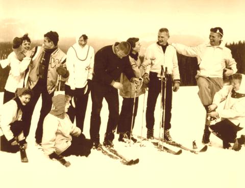 Collegiate skiers on old wood skis.