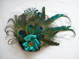 green and blue peacock feather headpiece by indigo daisy hat shop