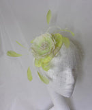 acid yellow and ivory feather and flower fascinator hat by indigo daisy hat shop