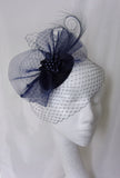 navy blue veiled matilda fascinator by indigo daisy hat shop