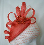 orange sinamay loop structured fascinator by indigo daisy hat shop