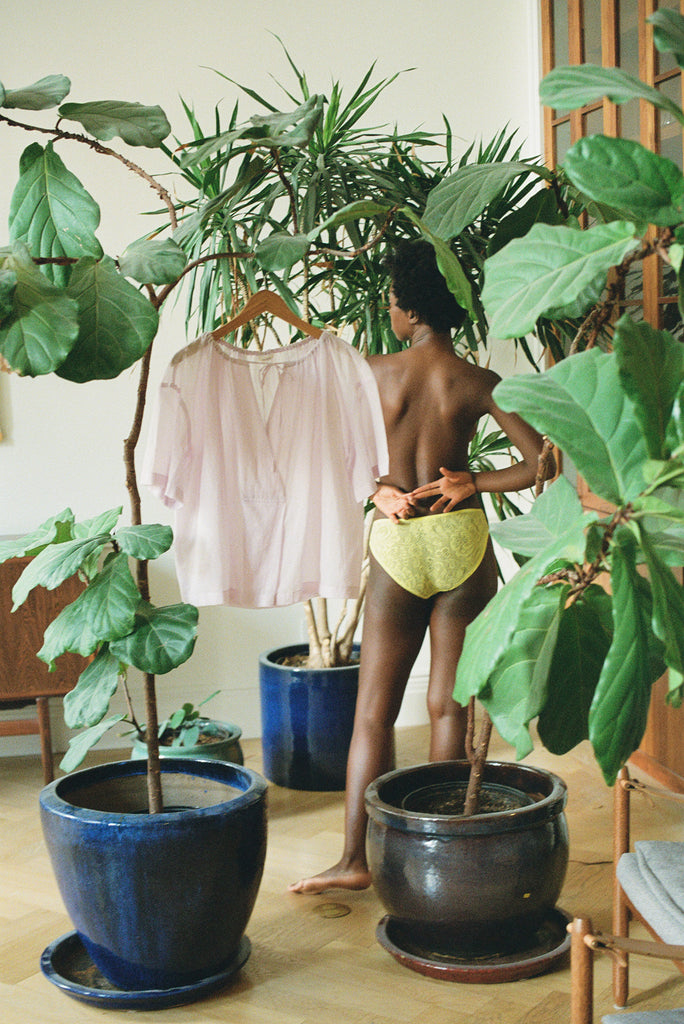 Woman standing in  yellow underwear