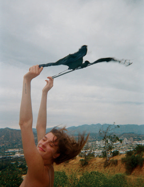 Women waving a bra over her head