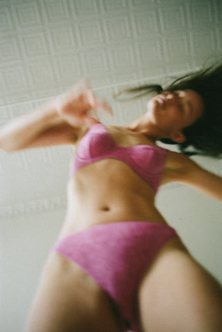 Woman in pink lingerie dancing