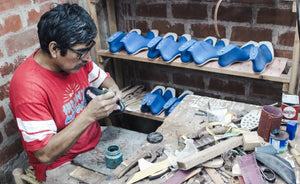 Image of shoemakers at Carlos' workshop