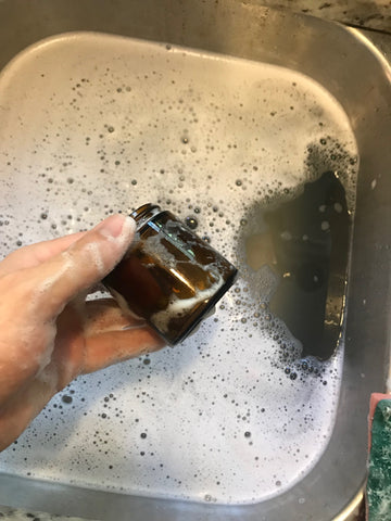 Washing out candle jar