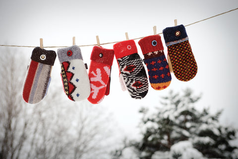 baabaazuzu sweater mittens on a clothesline